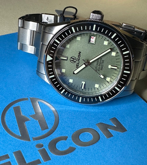 Helicon Master 62 Dive Watch in Lichen with an Archie Designs notebook